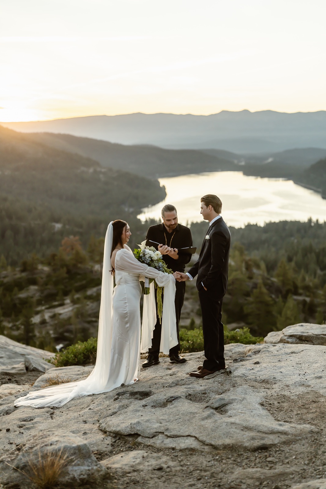 Bride and groom say their vows at the sunrise Donner Lake Overlook elopement
