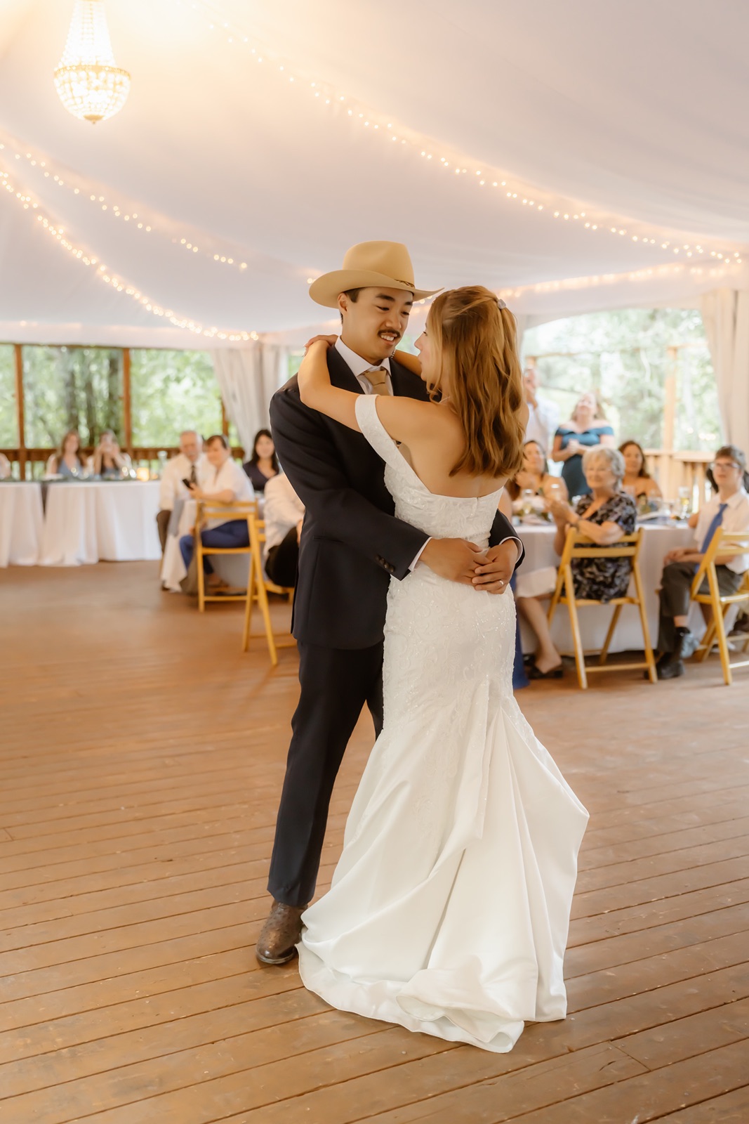 Bride and groom have first dance under the tent at their Double Eagle Resort wedding