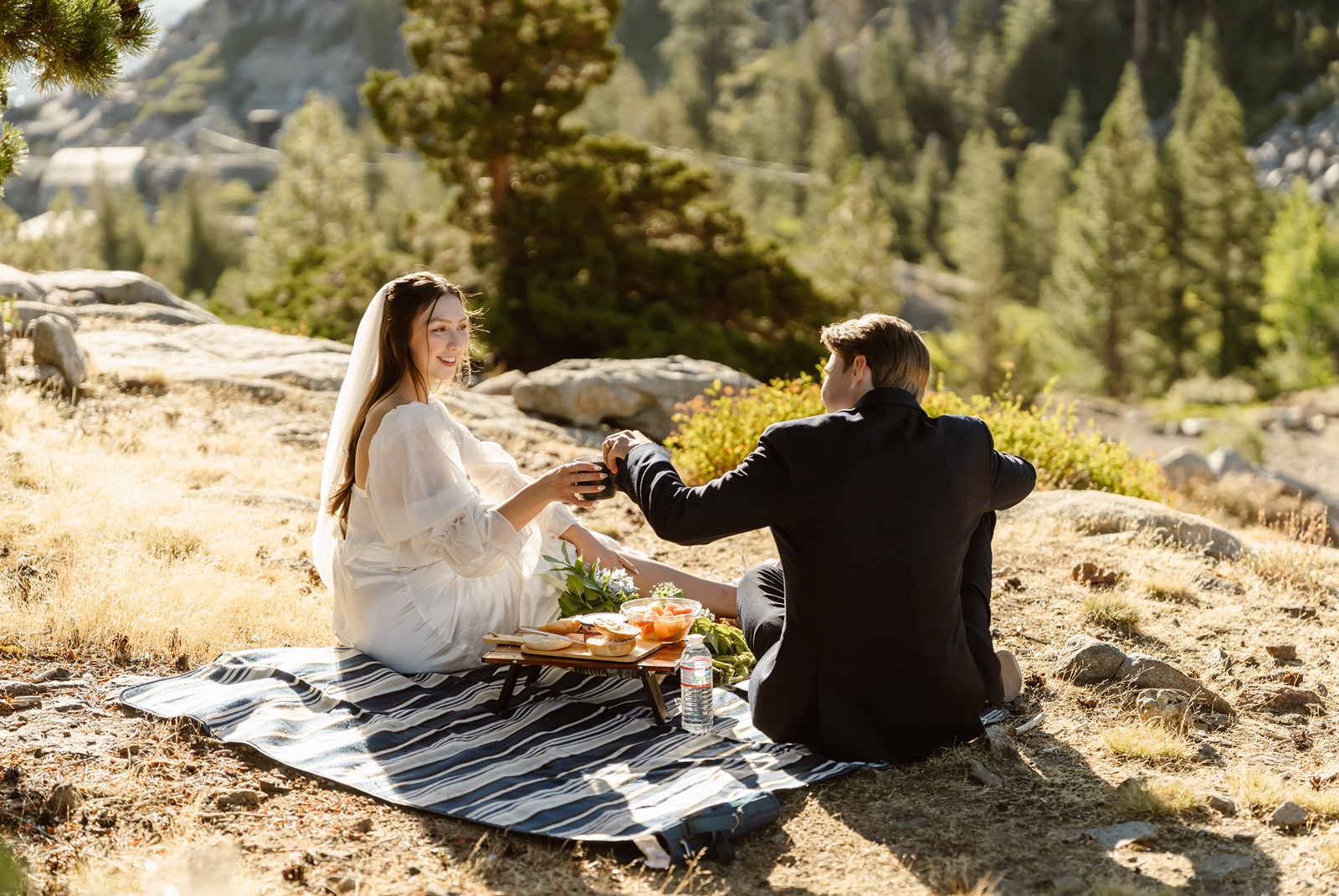 Bride and groom have a picnic at Donner Lake Overlook