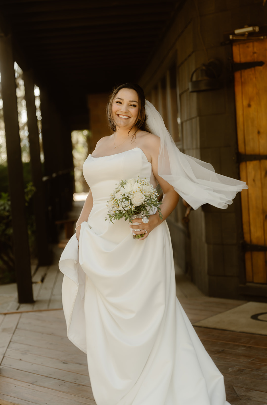 Bride smiles in wedding dress at Greenhorn Ranch wedding