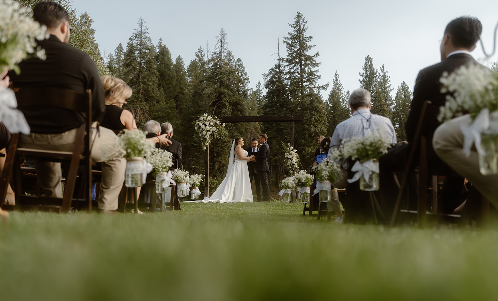 Bride and groom say their vows at their Greenhorn Ranch wedding ceremony