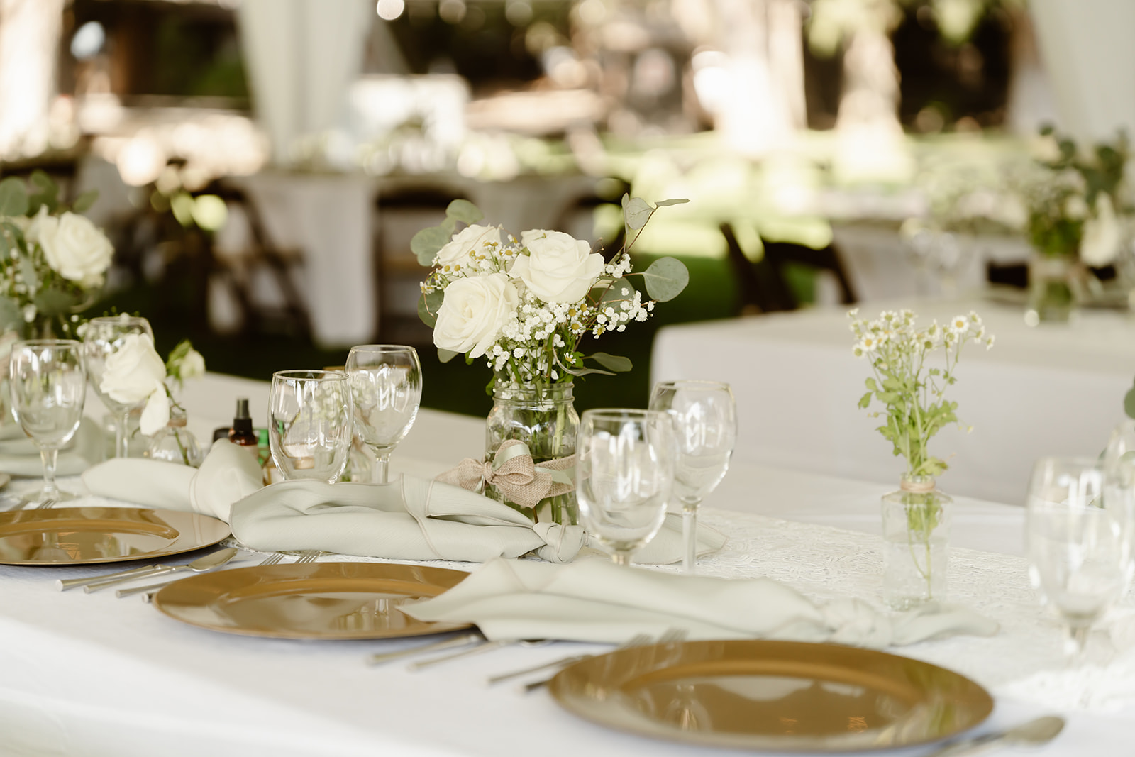 White and green wedding reception decor at the tented Greenhorn Ranch wedding