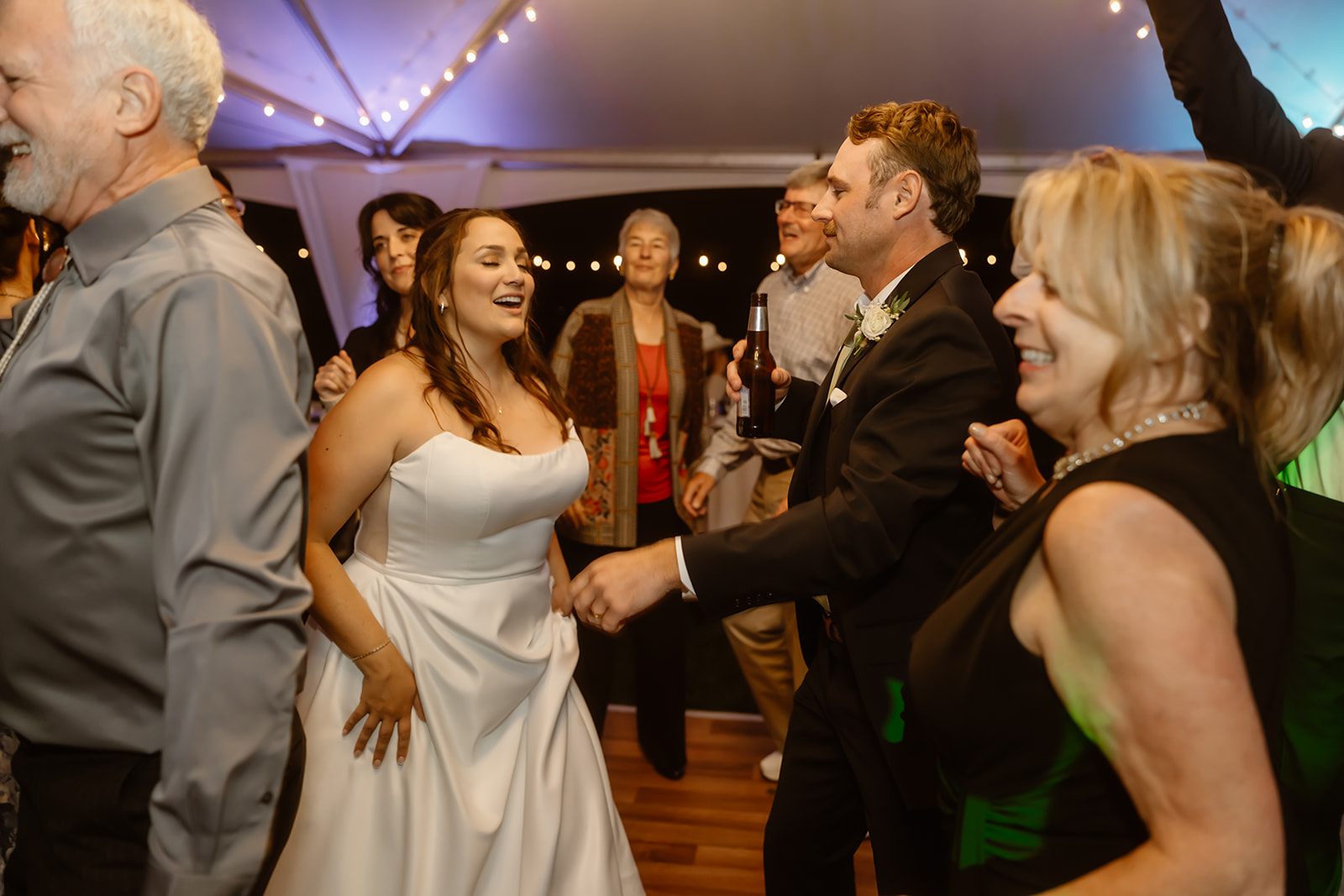 Bride and groom dance with their guests at their Greenhorn Ranch wedding reception