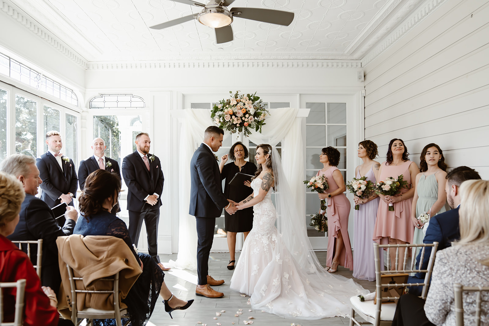 Bride and groom say their vows at Sequoia Mansion