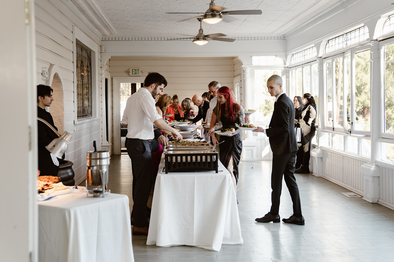 Guests getting dinner at the Sequoia Mansion wedding reception