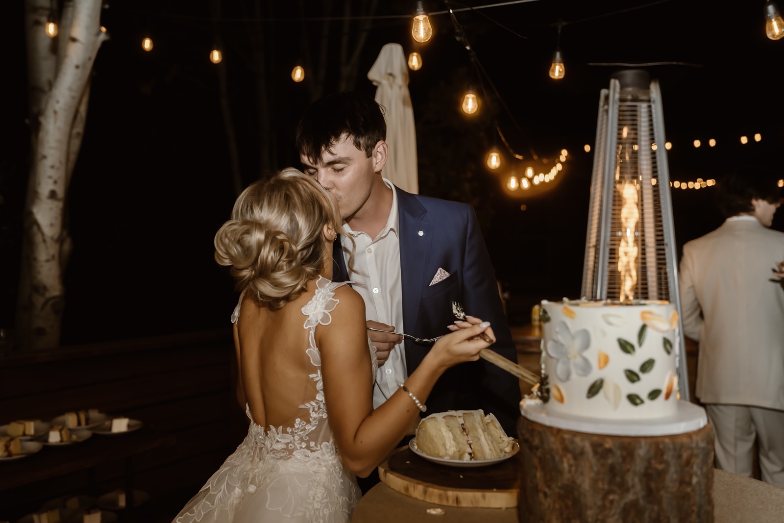 Bride and groom cut the wedding cake at their Desolation Hotel wedding