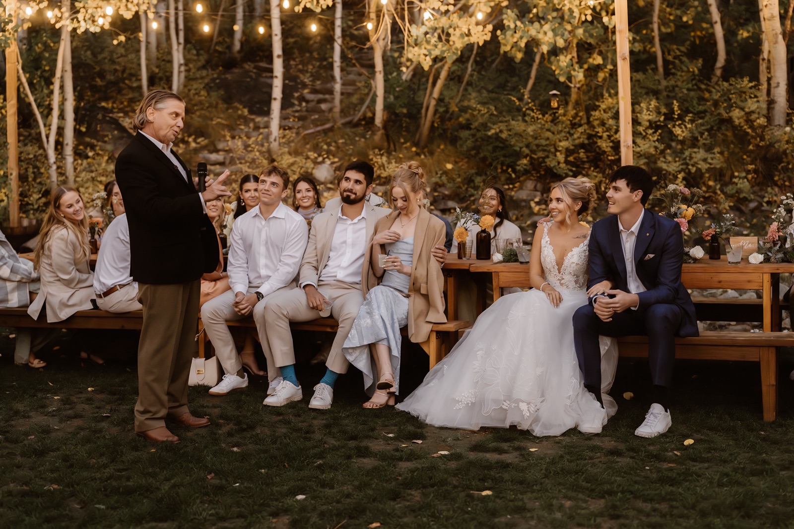 Bride and groom listen to toasts at the Desolation Hotel wedding