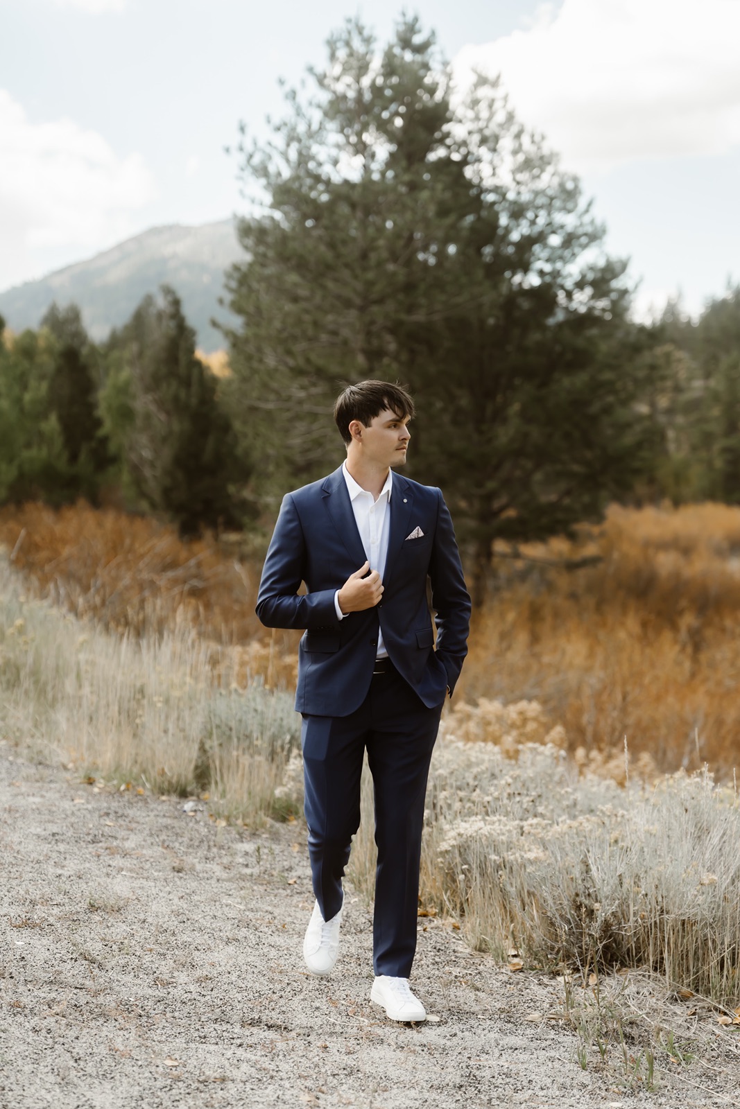 Groom in suit at Desolation Hotel wedding