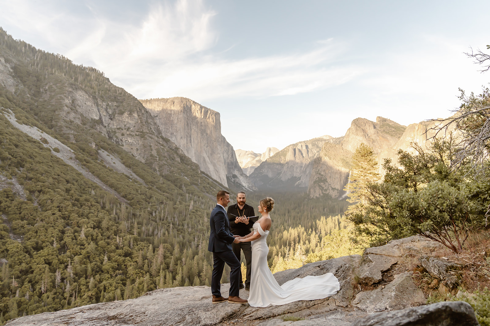 Bride and groom with their officiant at the Yosemite Falls elopement ceremony