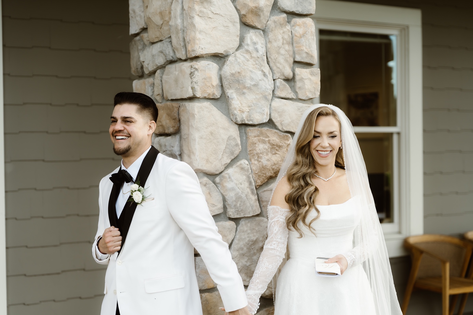 Bride and groom first touch at Stonetree Estate wedding