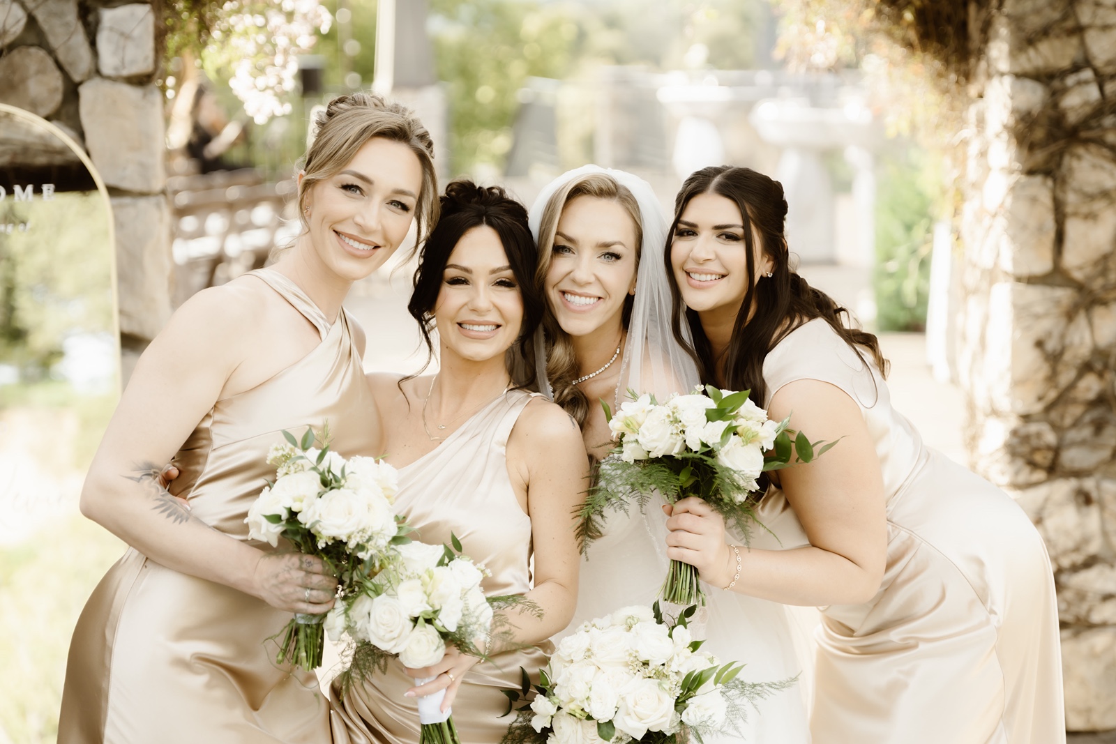 Bridesmaids in gold dresses at the Stonetree Estate wedding