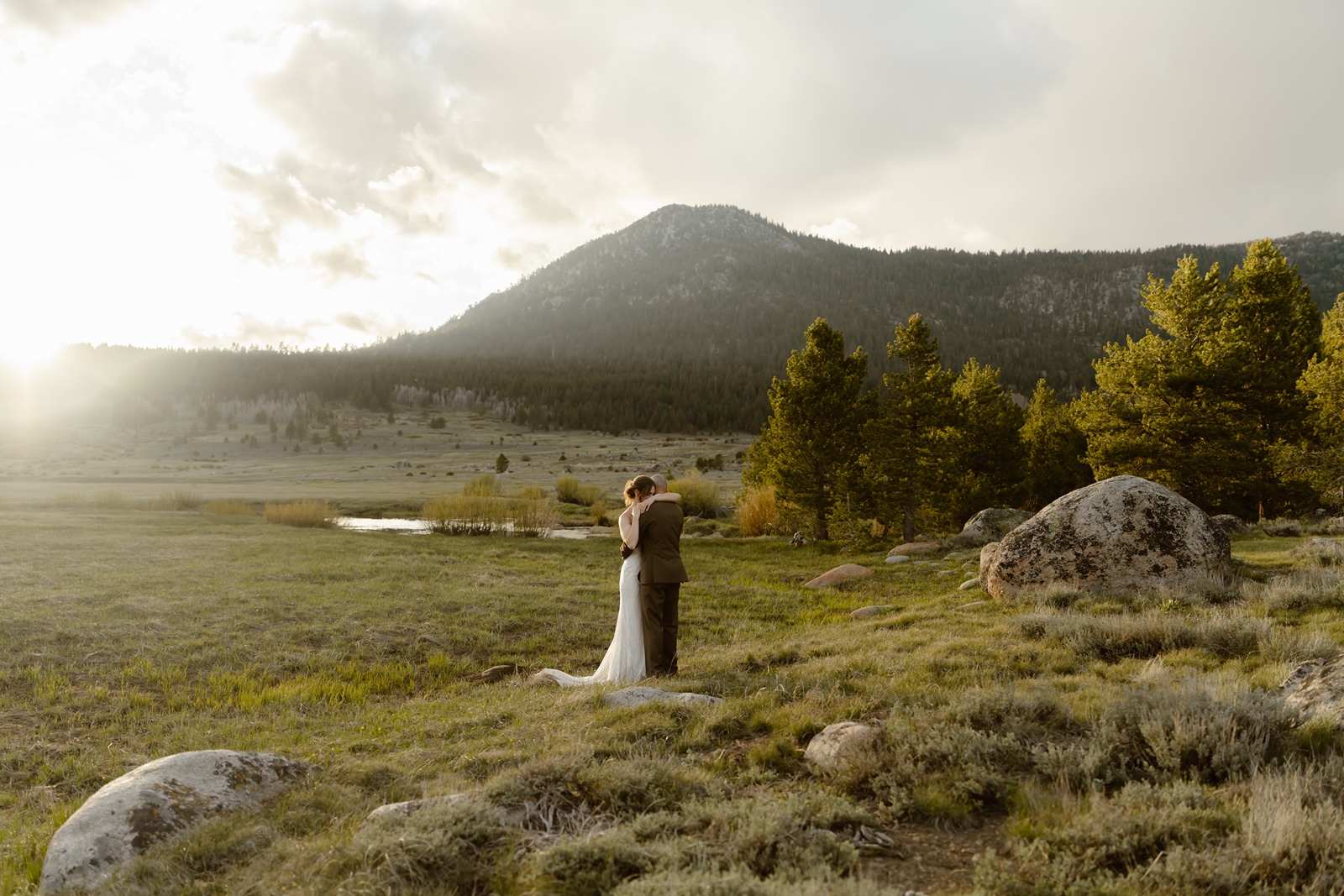 Couple embraces at their mountain elopement