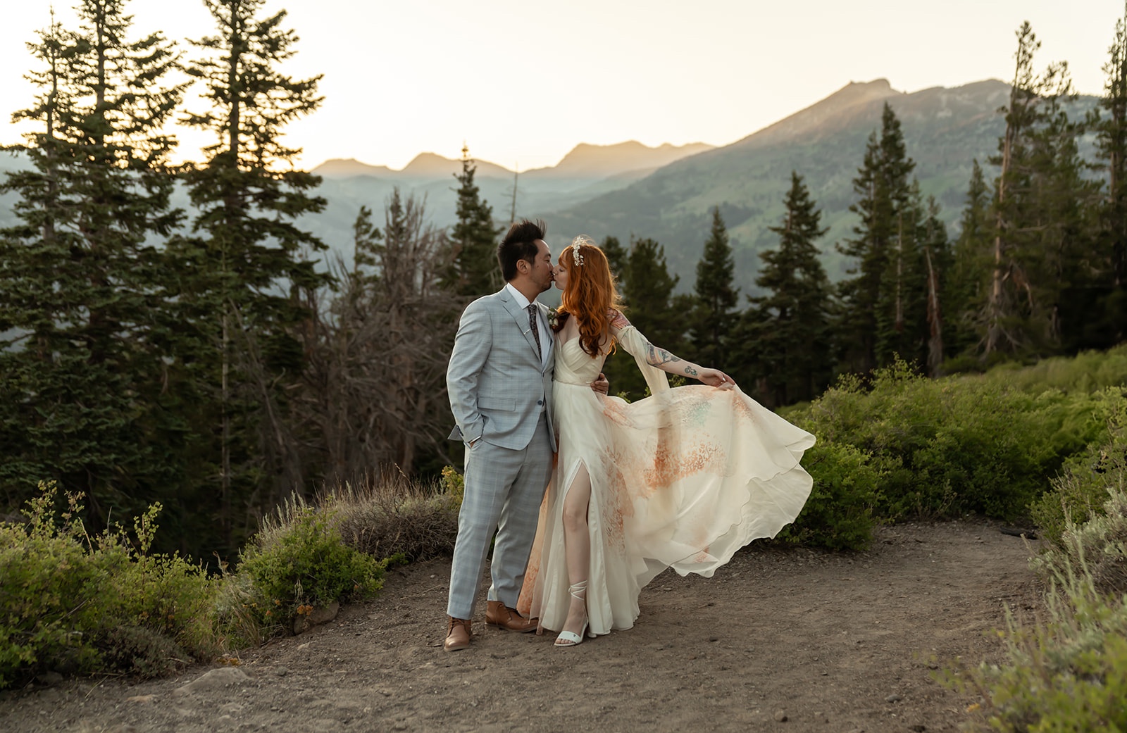 Couple kisses at their mountain elopement